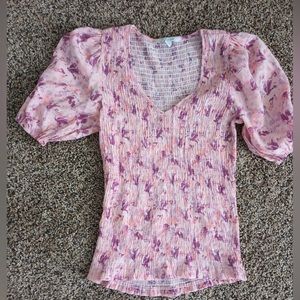 This is an extra small it’s super cute. In style and it’s tight fitting